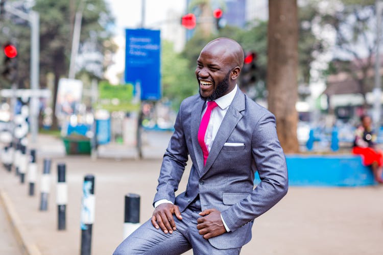 A Happy Man In A Grey Suit