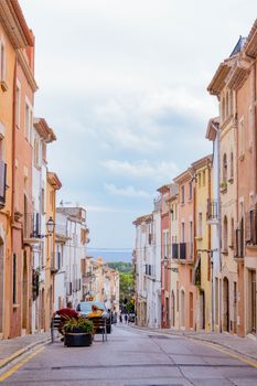 A picturesque street scene in Altafulla, showcasing colorful historic architecture.