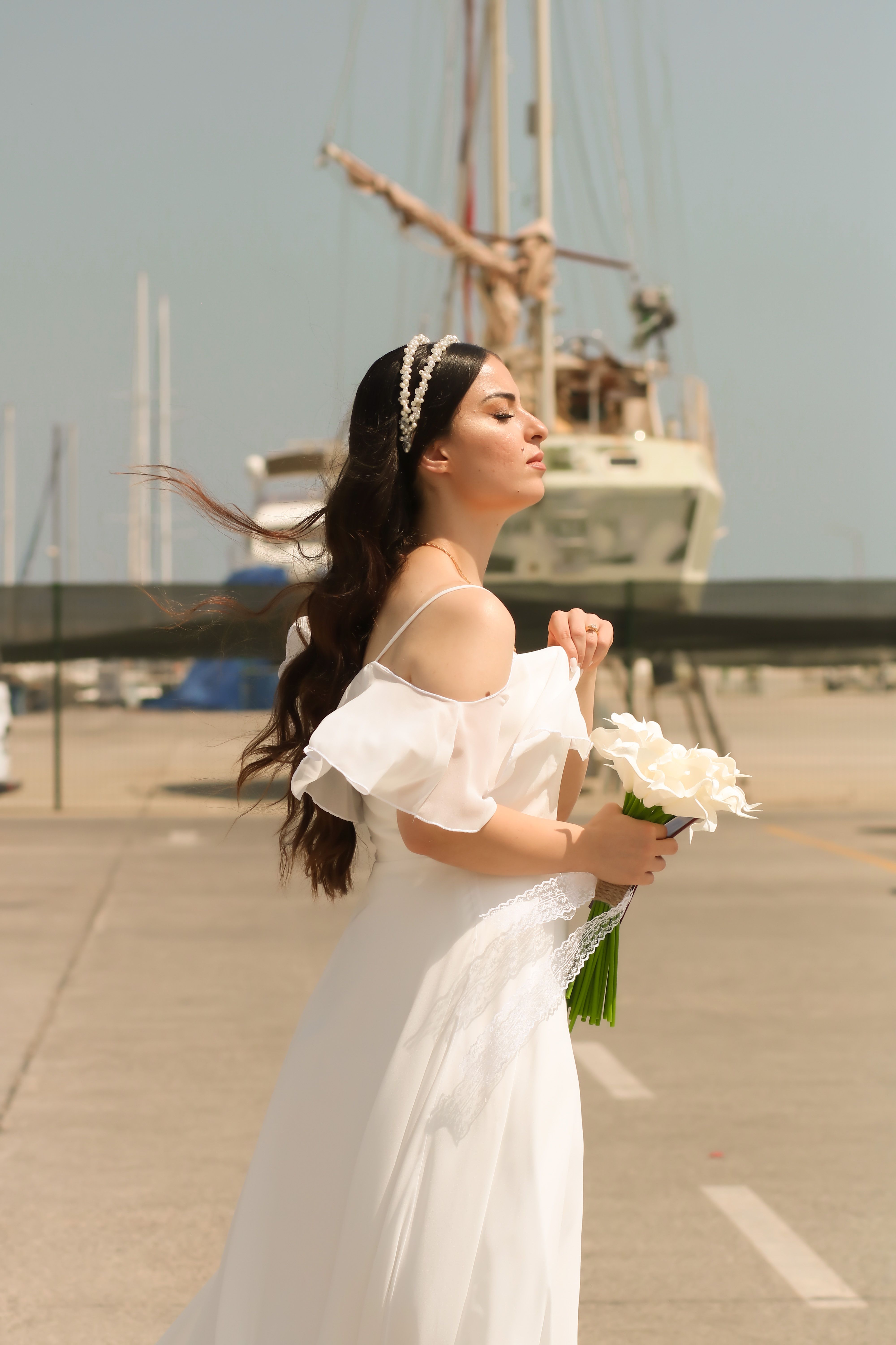 Woman in White Dress Holding Bouquet of White Flowers · Free Stock Photo