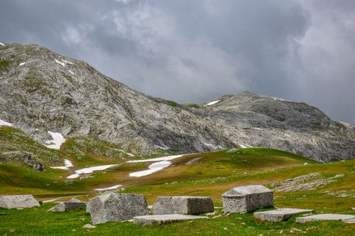 Free Idyllic mountain view with rocky peaks and grassy slopes under overcast skies in Bosnia and Herzegovina. Stock Photo