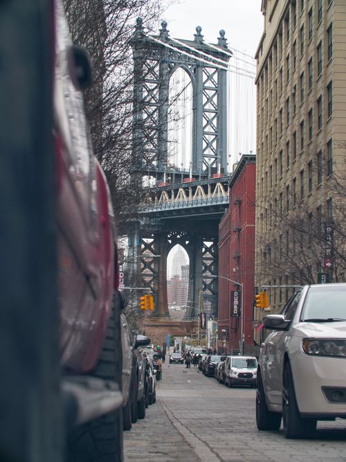 Free Urban scene featuring the Manhattan Bridge in New York City, captured from street level. Stock Photo