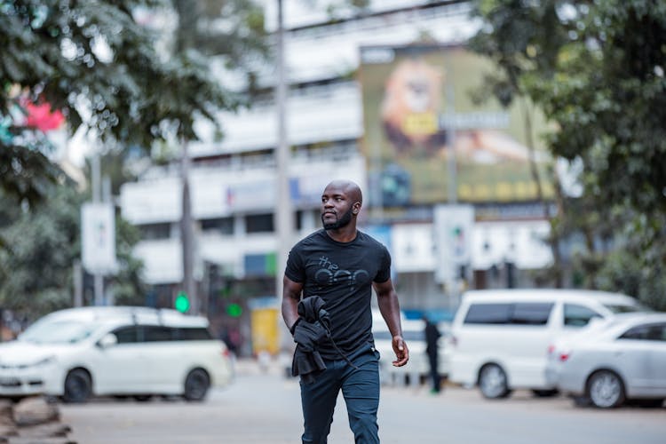 Man In Casual Clothing Walking In City 