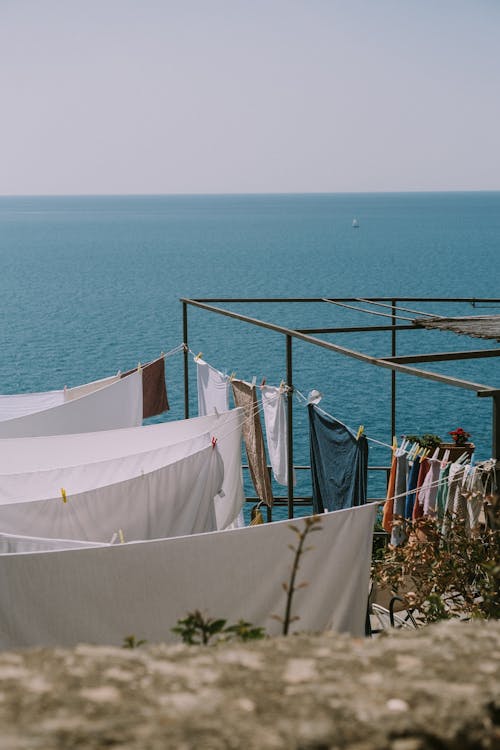 Clothes and Blankets Hanging on Clotheslines