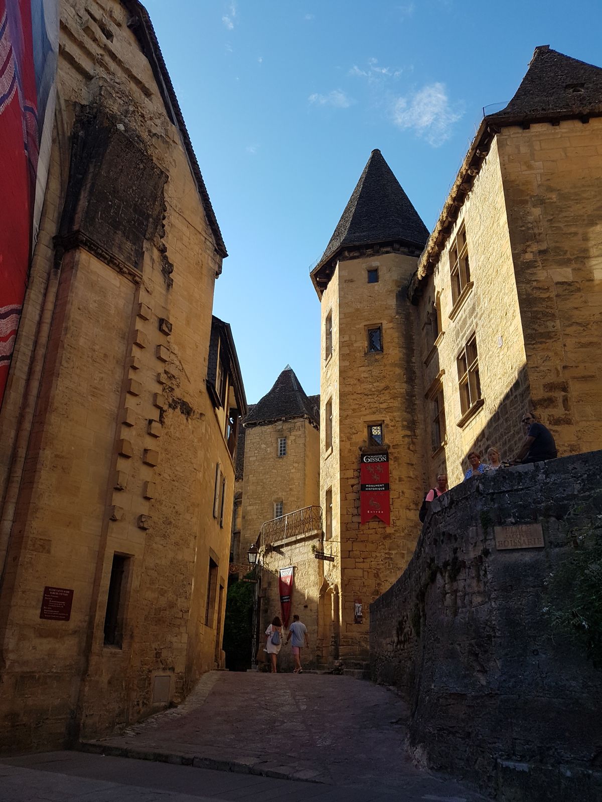A honey-gold medieval lane in Sarlat at golden hour