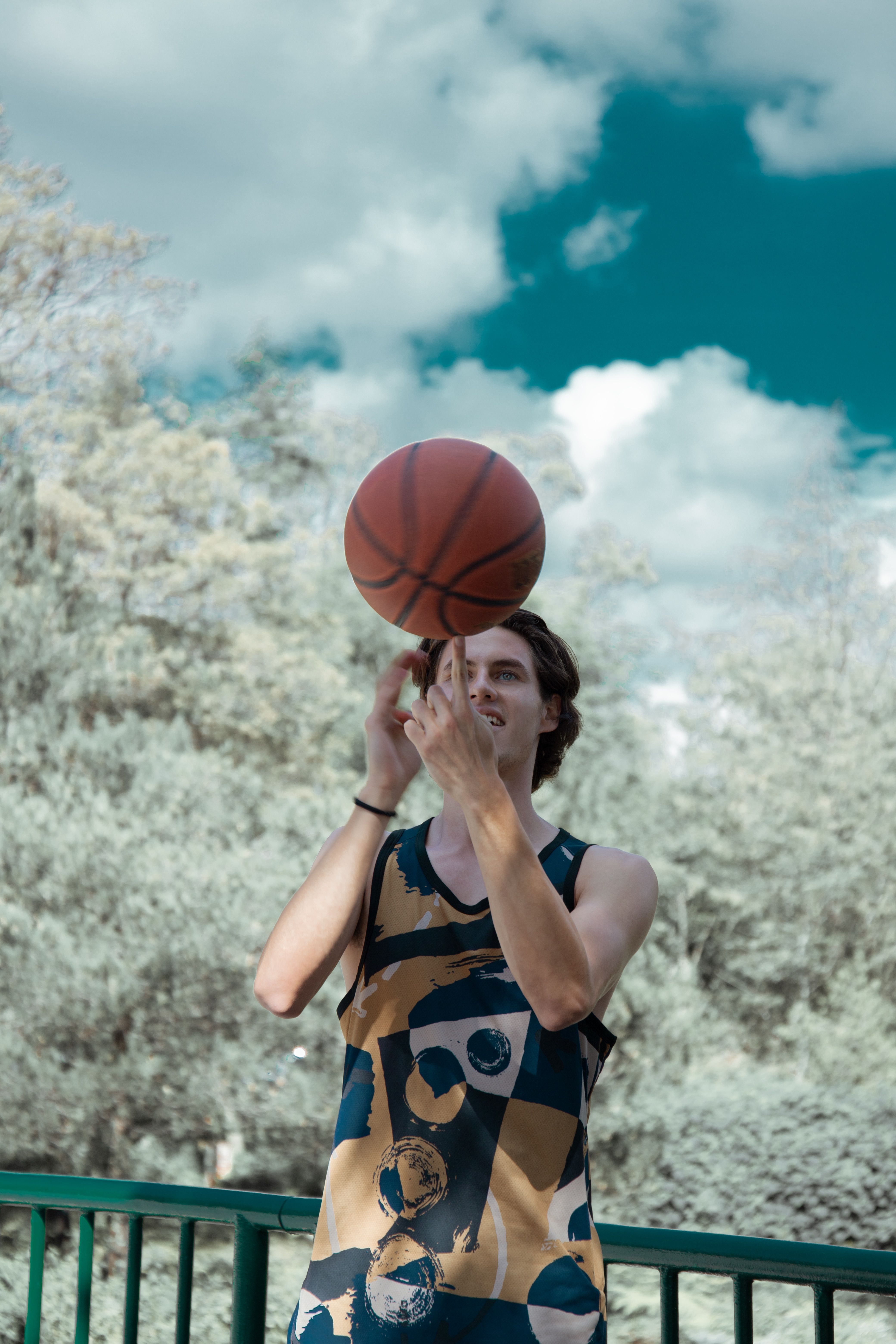 Man in Tank Top Plating with a Ball