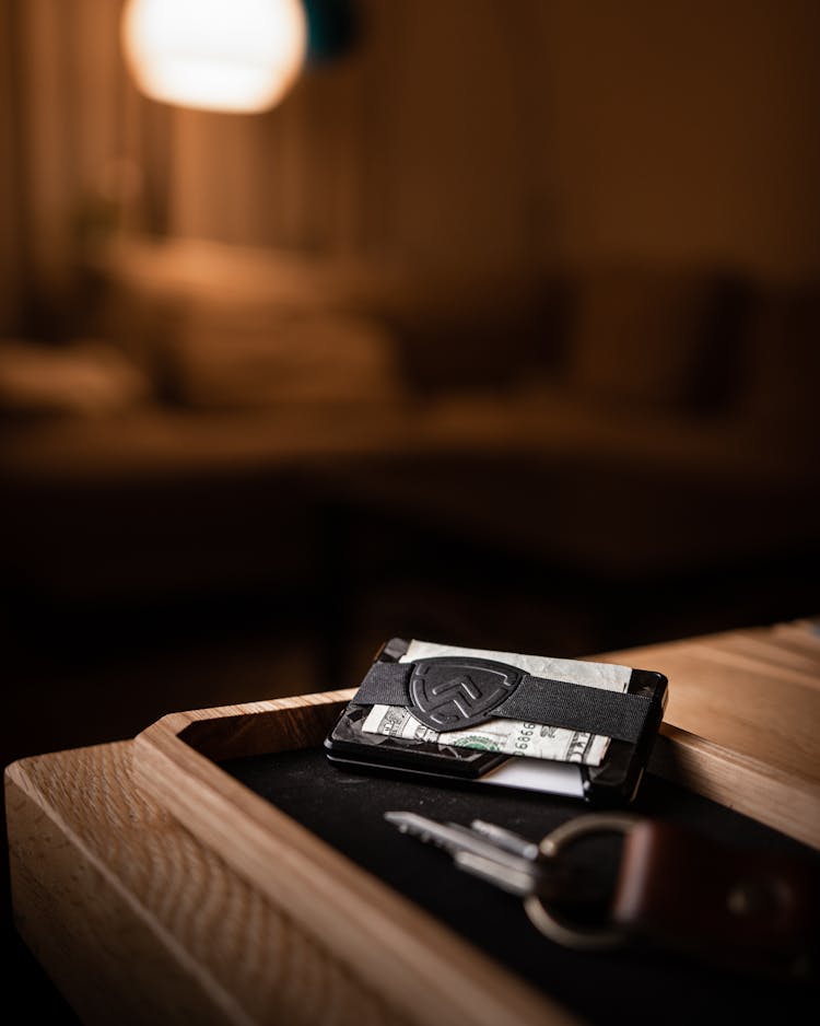 A Wallet And Keys On A Table