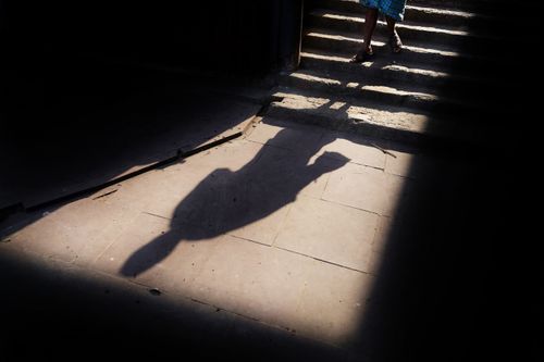 Free Dramatic shadow silhouette of a person on steps in Kolkata, India. Stock Photo