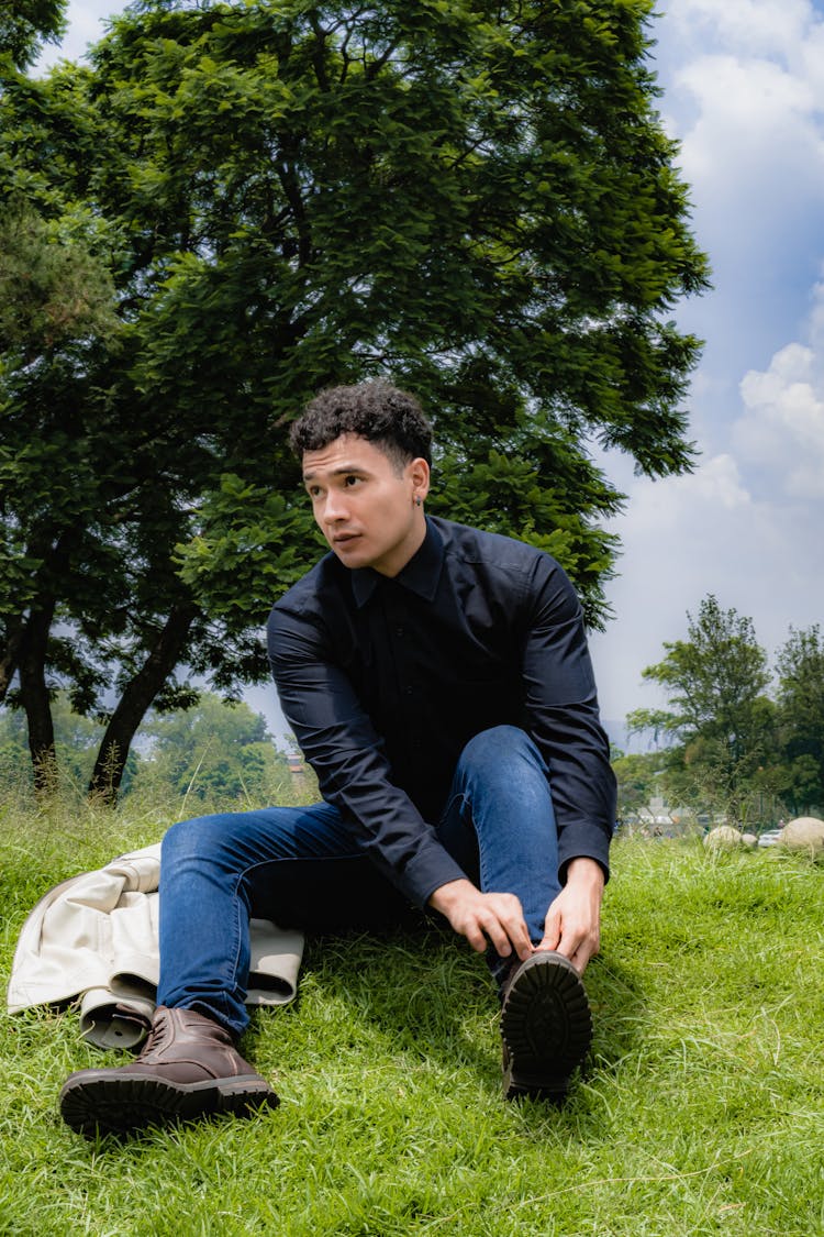 Photo Of Man Tying His Shoelace