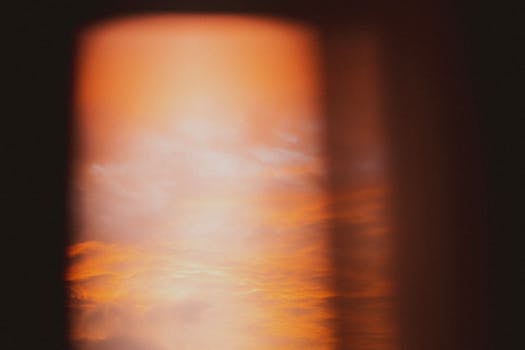 An abstract view of an orange sky at twilight with blurred motion adding an artistic feel.