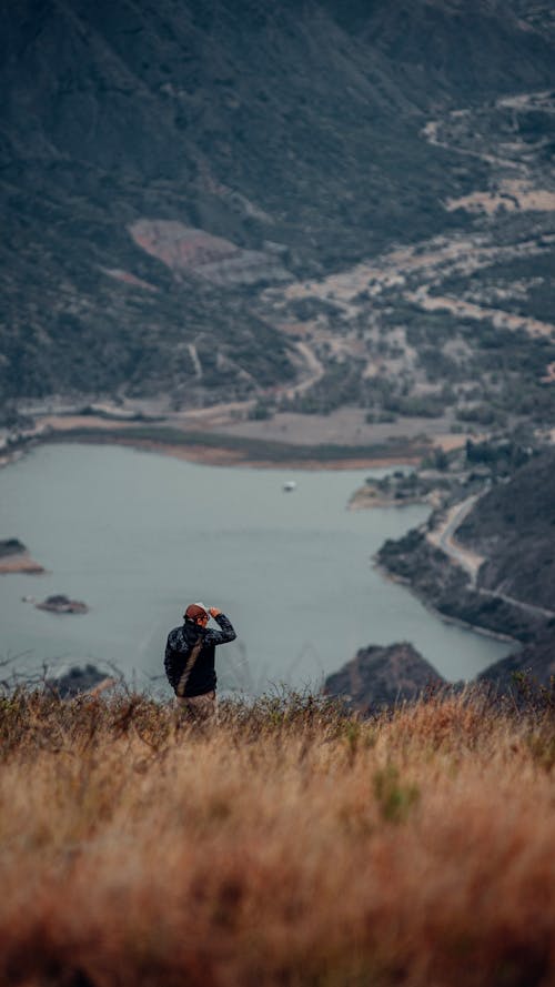 Man Standing on Mountain Side