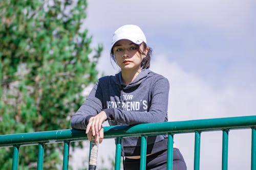 Pretty Woman Wearing a White Cap