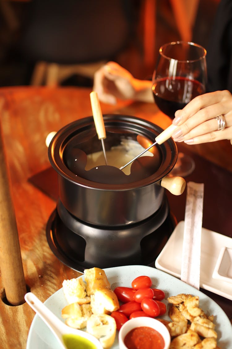 Skewers On Melted Cheese On A Pot