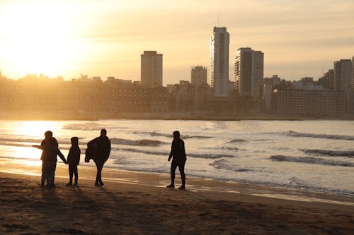 Fotos de stock gratuitas de atardecer, beach, buildings