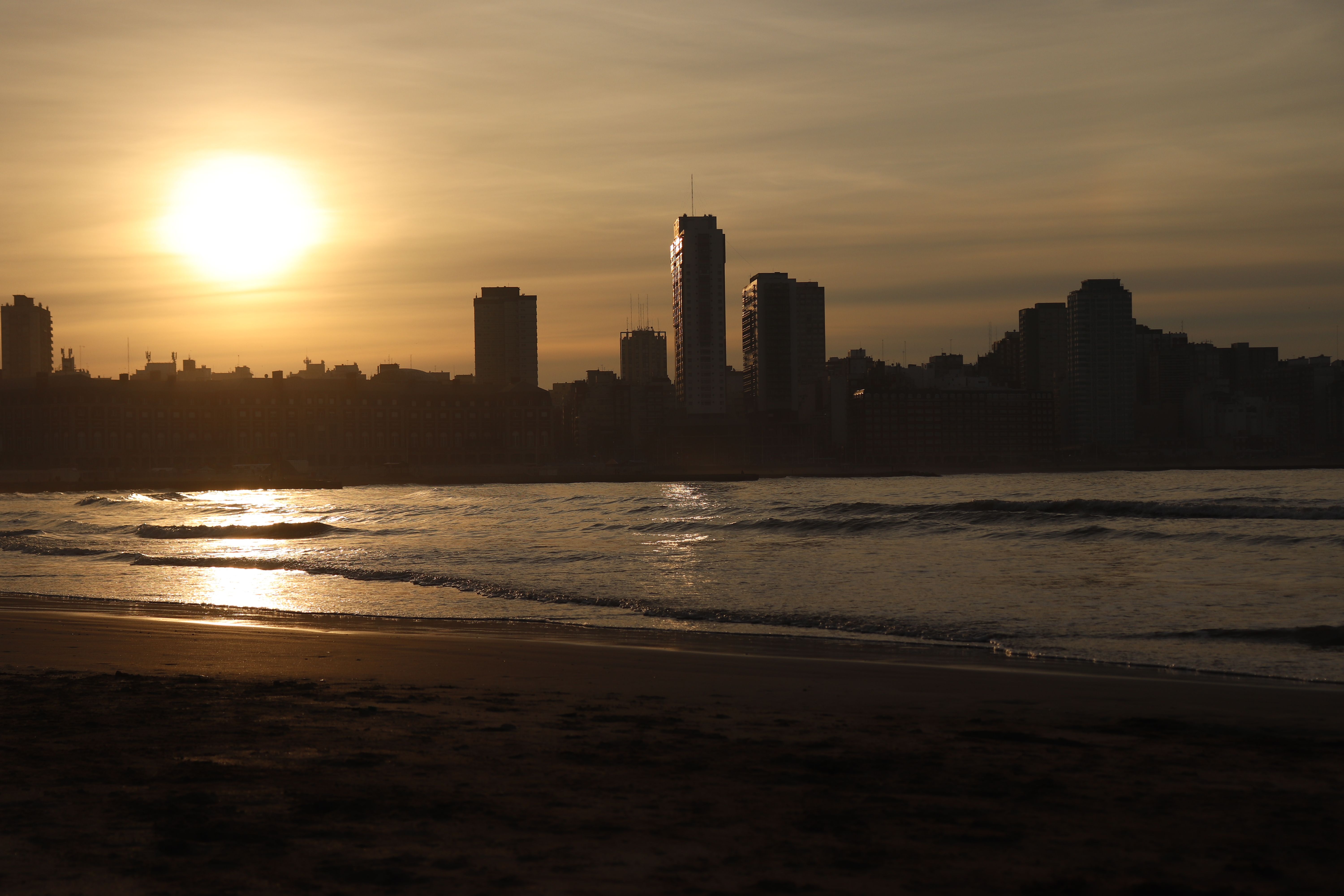 Silhouette of Buildings by the Beach · Free Stock Photo