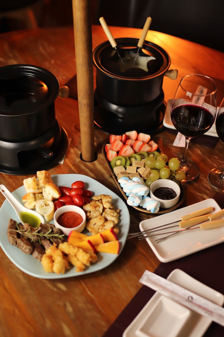 Table Full Of Food For Tasting A Fondue