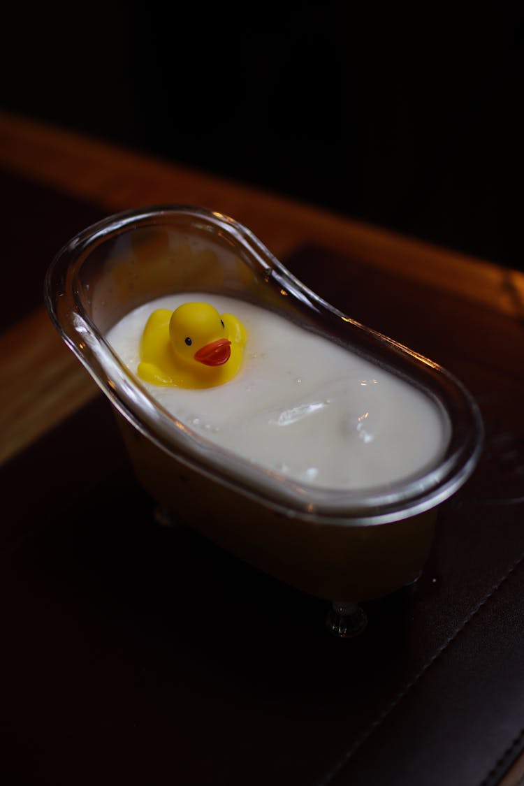 White Liquid On Miniature Bathtub