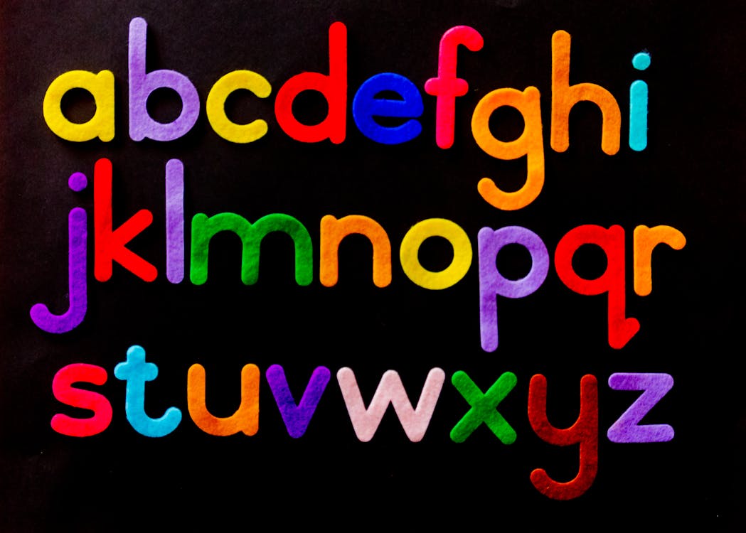 Free Alphabet Letter Text on Black Background Stock Photo