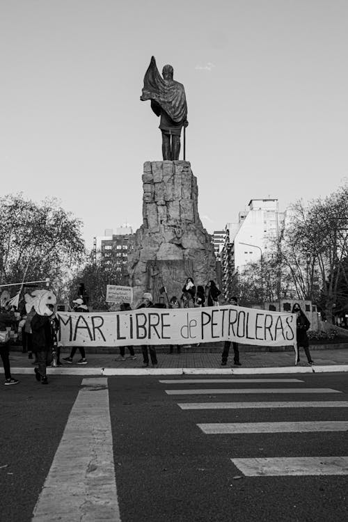 People on a Manifestation in Front of a Monument in Black and White 