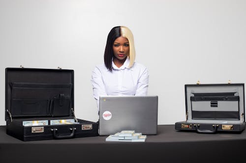 Woman Working on Laptop in an Office