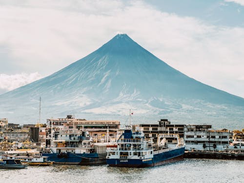 Container Ships Moored at the Port with the Mayon Volcano in the Background