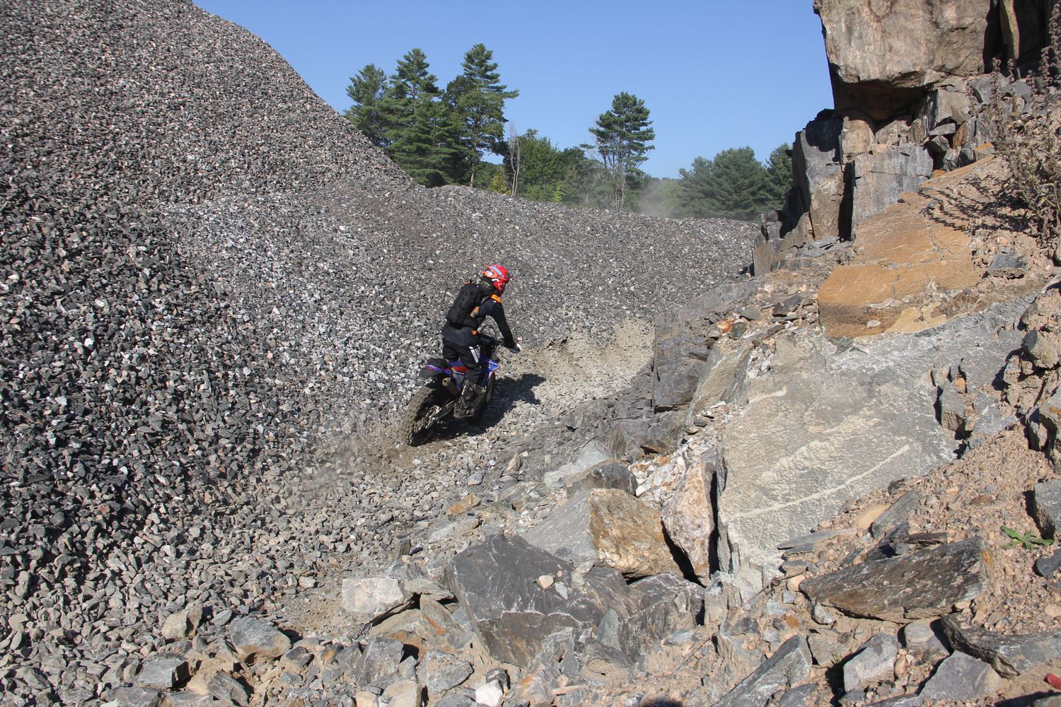 Enduro action photo on rocky trail