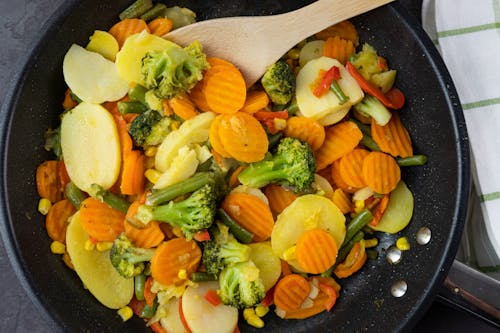 Free Close-Up Shot of Delicious Cooked Vegetables on Frying Pan Stock Photo