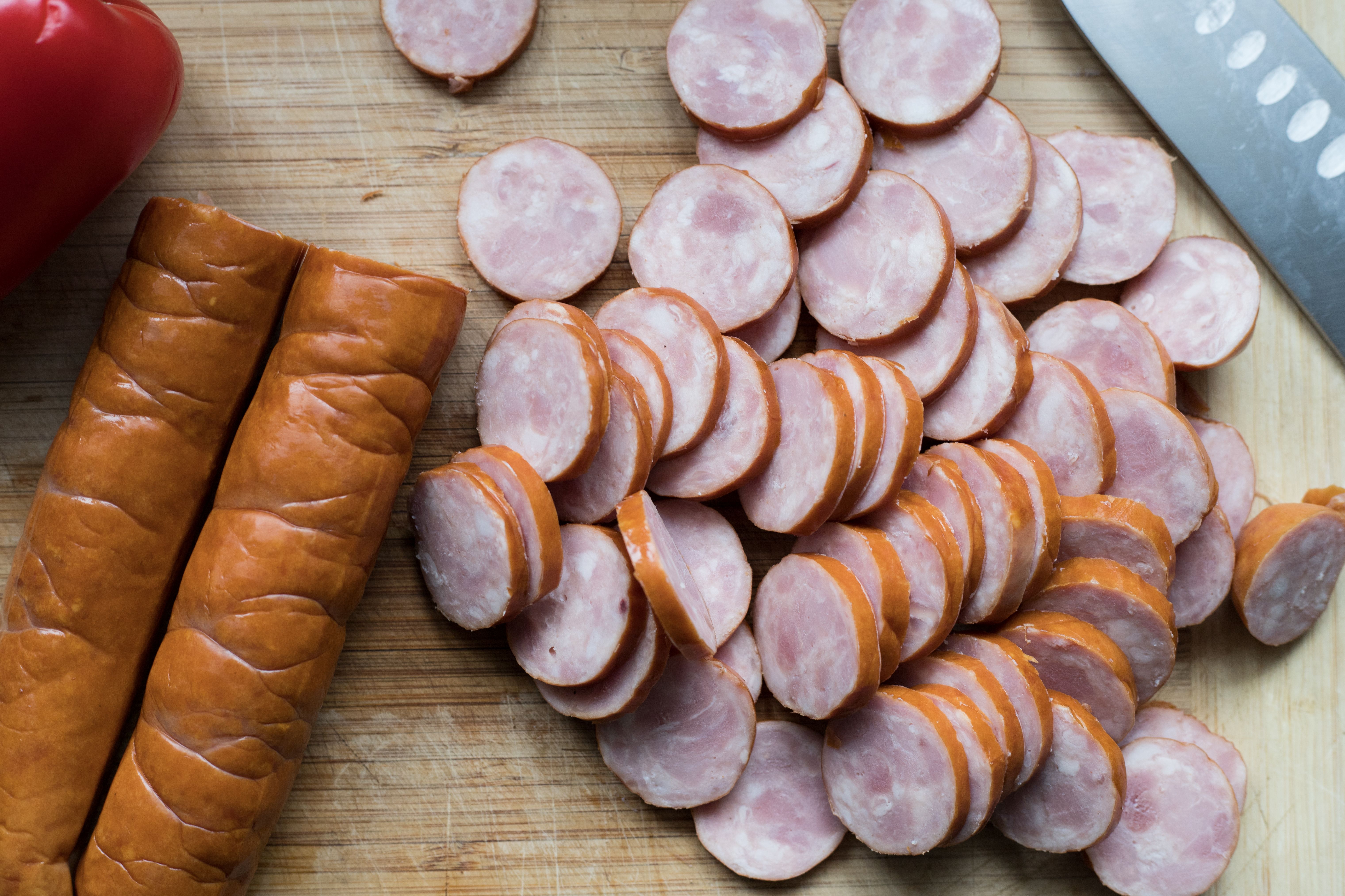Chopped Sausages on a Wooden Chopping Board
