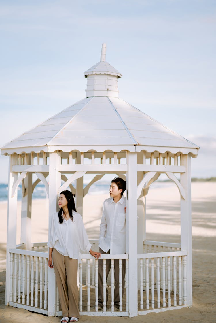 Couple In A Gazebo At The Beach