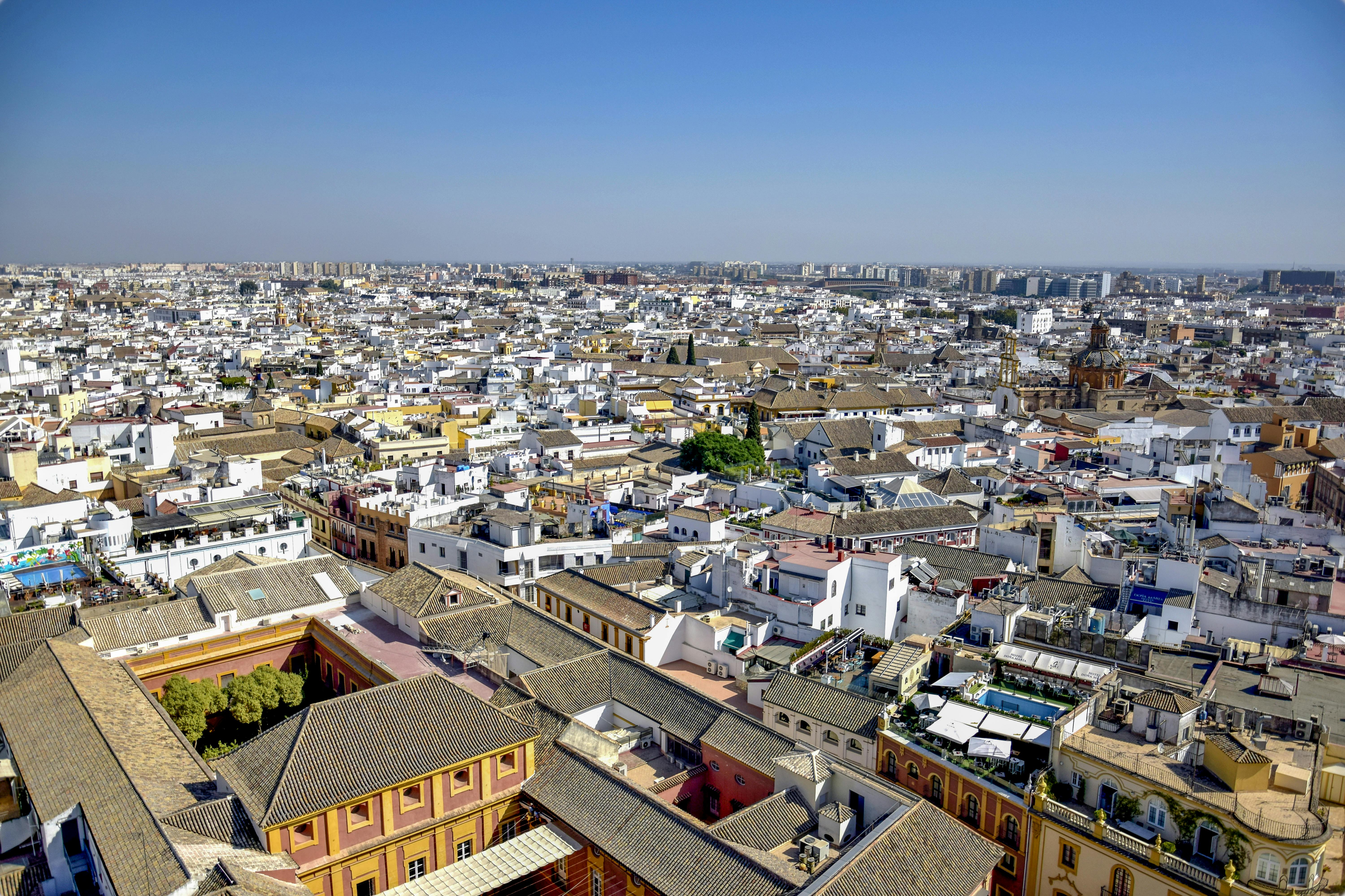 aerial view of city buildings under blue sky