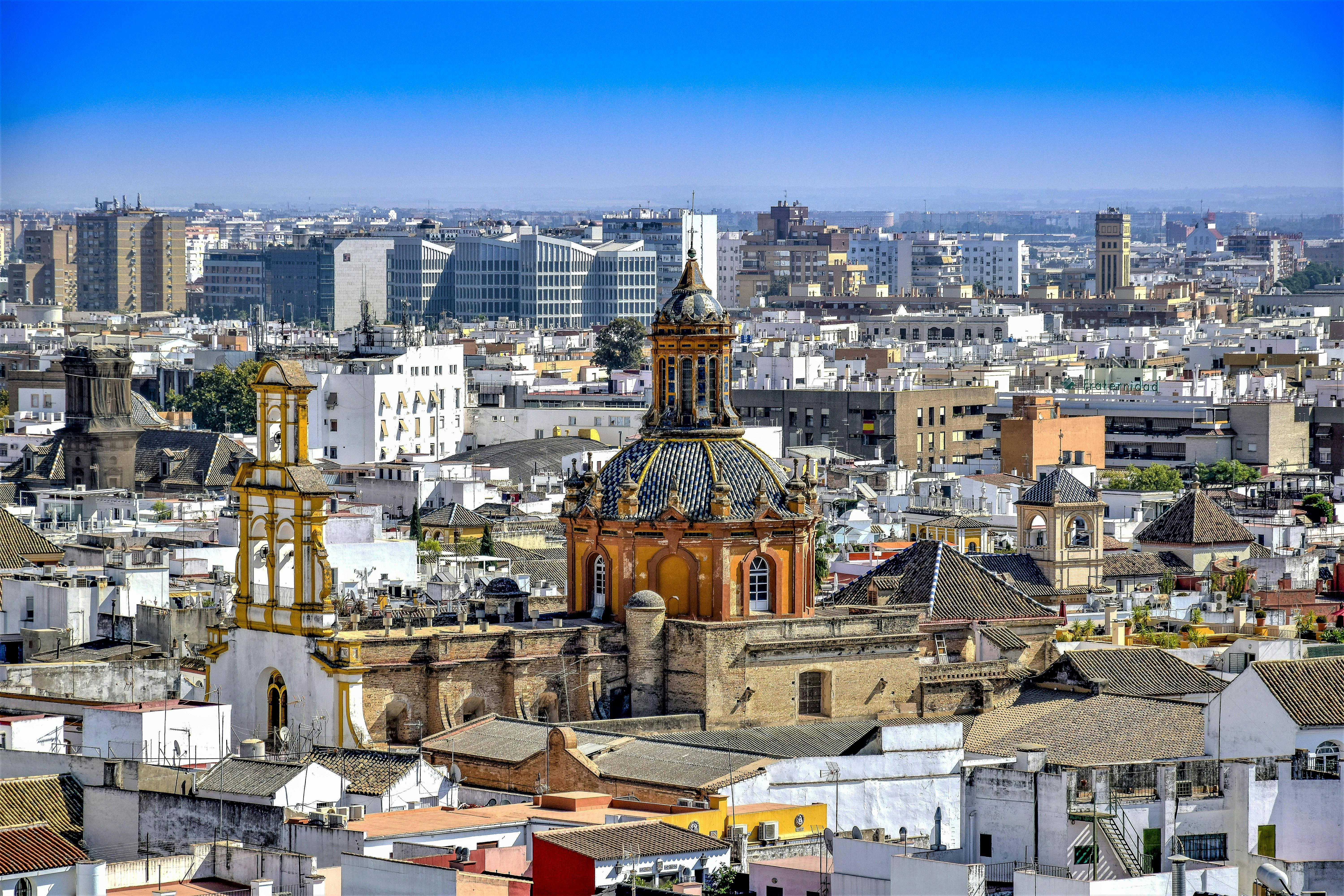 aerial view of city buildings under blue sky