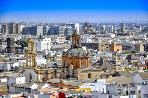 Aerial View of City Buildings Under Blue Sky