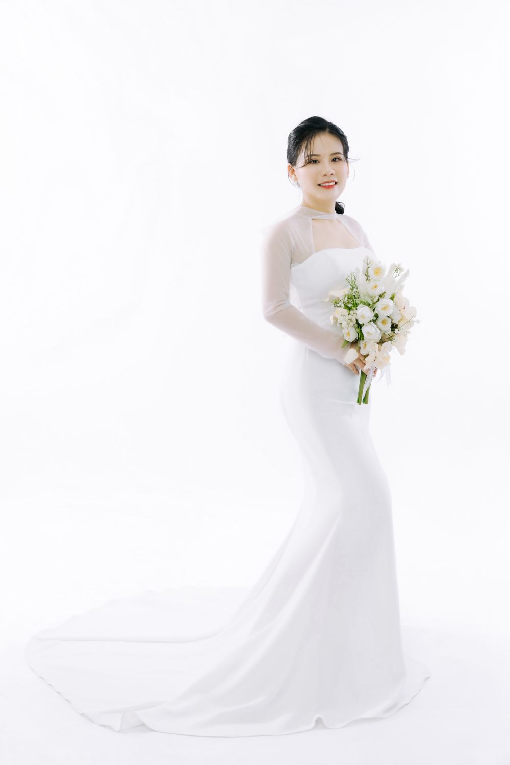 Bridal gown reflected in a wooden fitting room mirror