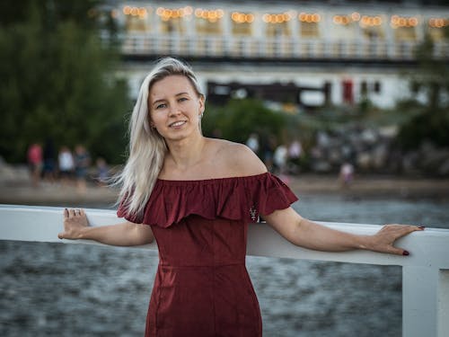 A Woman Wearing Off Shoulder Dress