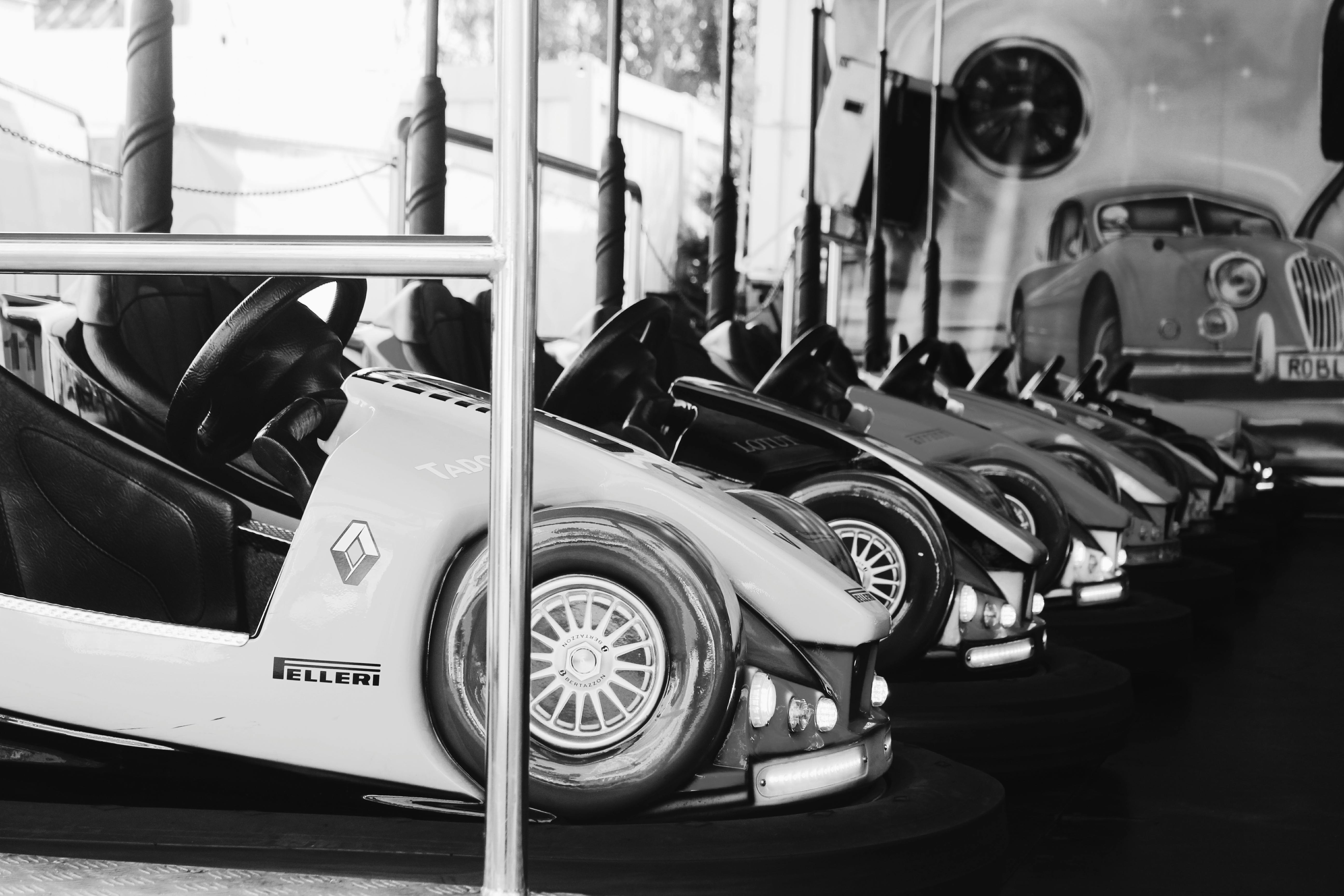 grayscale photography of parking vehicles