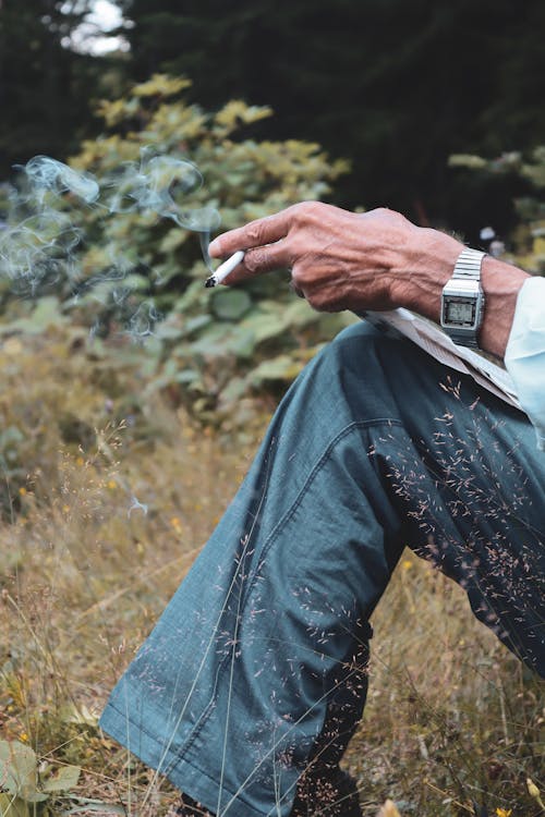 Close-Up Shot of a Person Smoking Cigarette