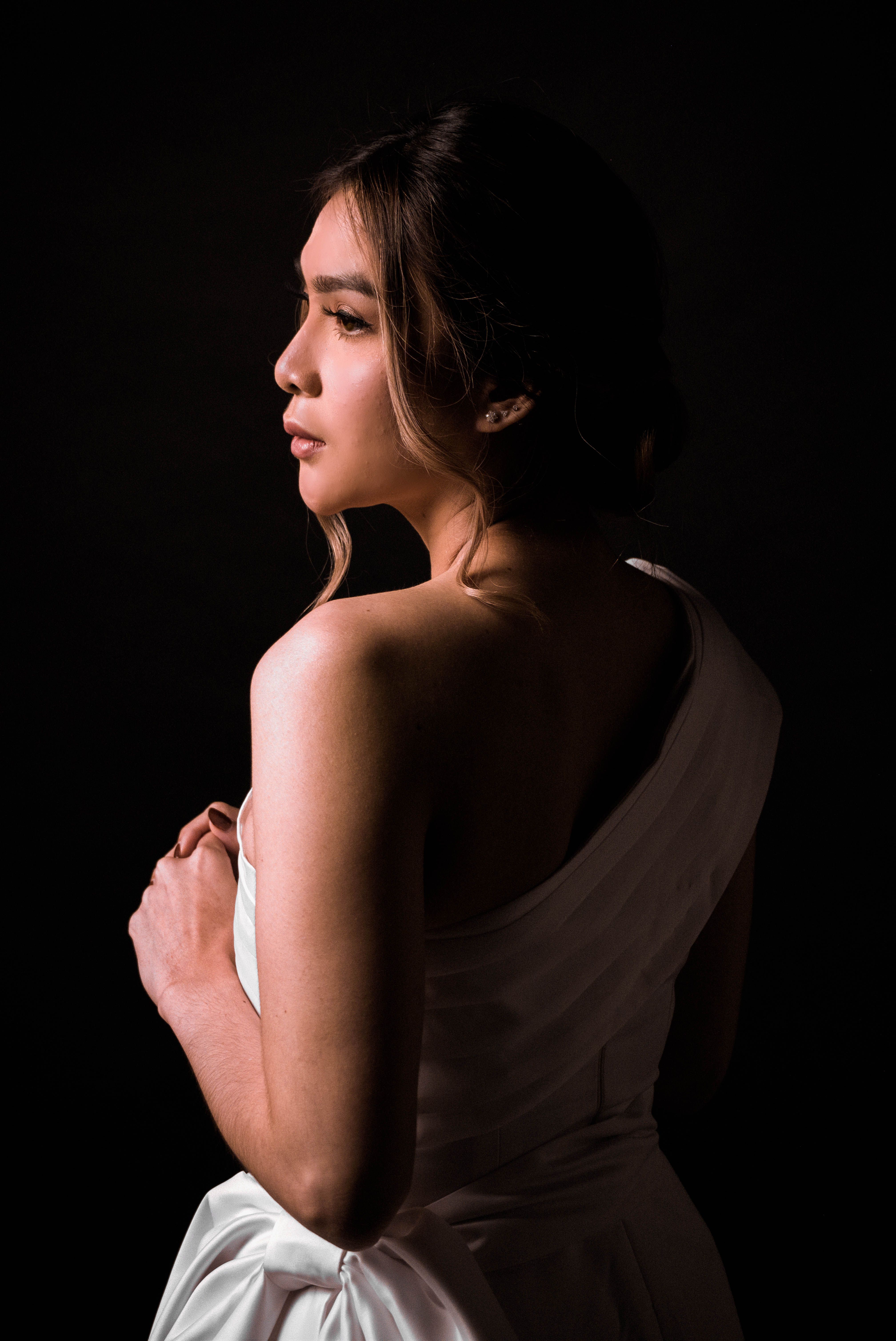 Back View Shot of a Woman in White Dress Looking Afar · Free Stock Photo