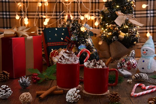 Close-Up Shot of Christmas Ornaments on Wooden Surface