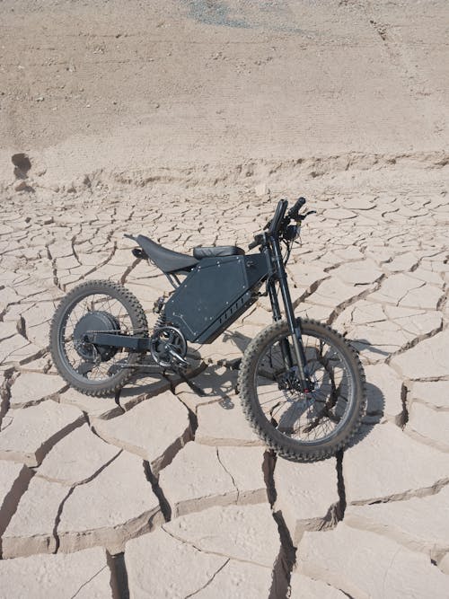 Motorcycle Parked on the Parched Desert