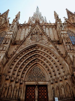 Intricate gothic architecture of the Barcelona Cathedral facade, a historic landmark in Spain.