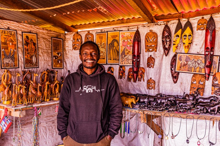 A Man Standing In A Store