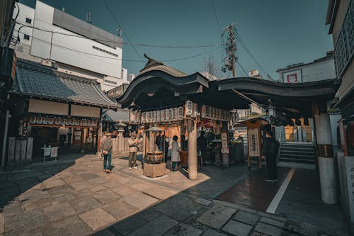 People Visiting a Temple