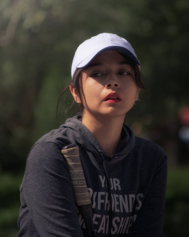 Portrait Of A Little Girl Wearing White Cap 