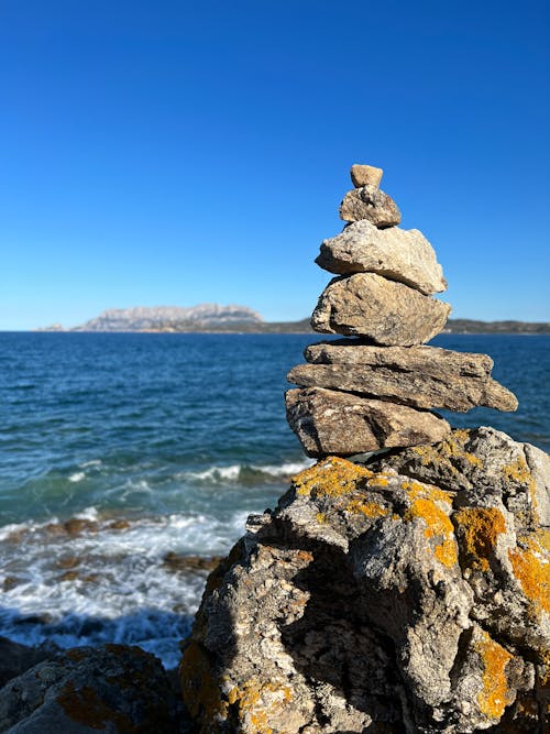 Stack of Rocks Near Body of Water