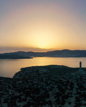 A stunning aerial view of sunset over Le Saline in Sardegna, Italy, showcasing the serene landscape and coastline.