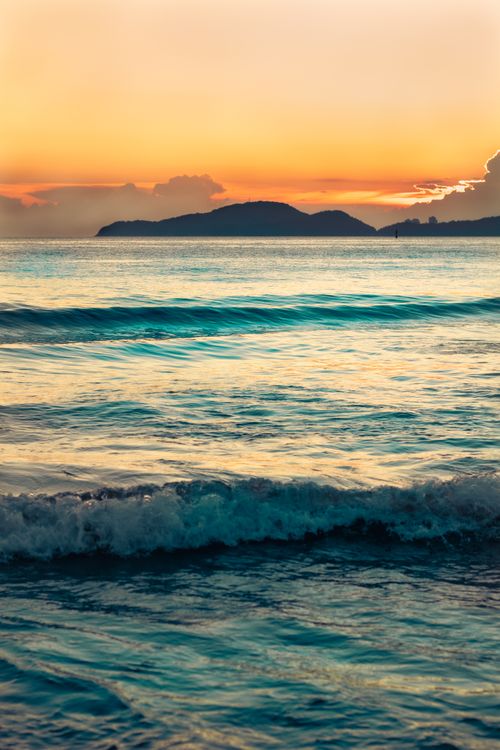 Free Captivating ocean sunset with gentle waves at Santos Beach, Brazil, evoking peace and tranquility. Stock Photo
