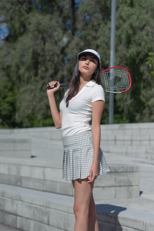 Female Tennis Player Holding a Racket
