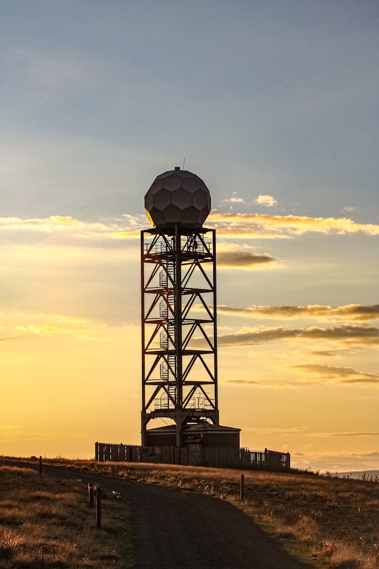 Silhouette Of A Radar Tower During Sunset