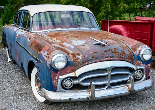 Rusting Packard in a Parking Lot