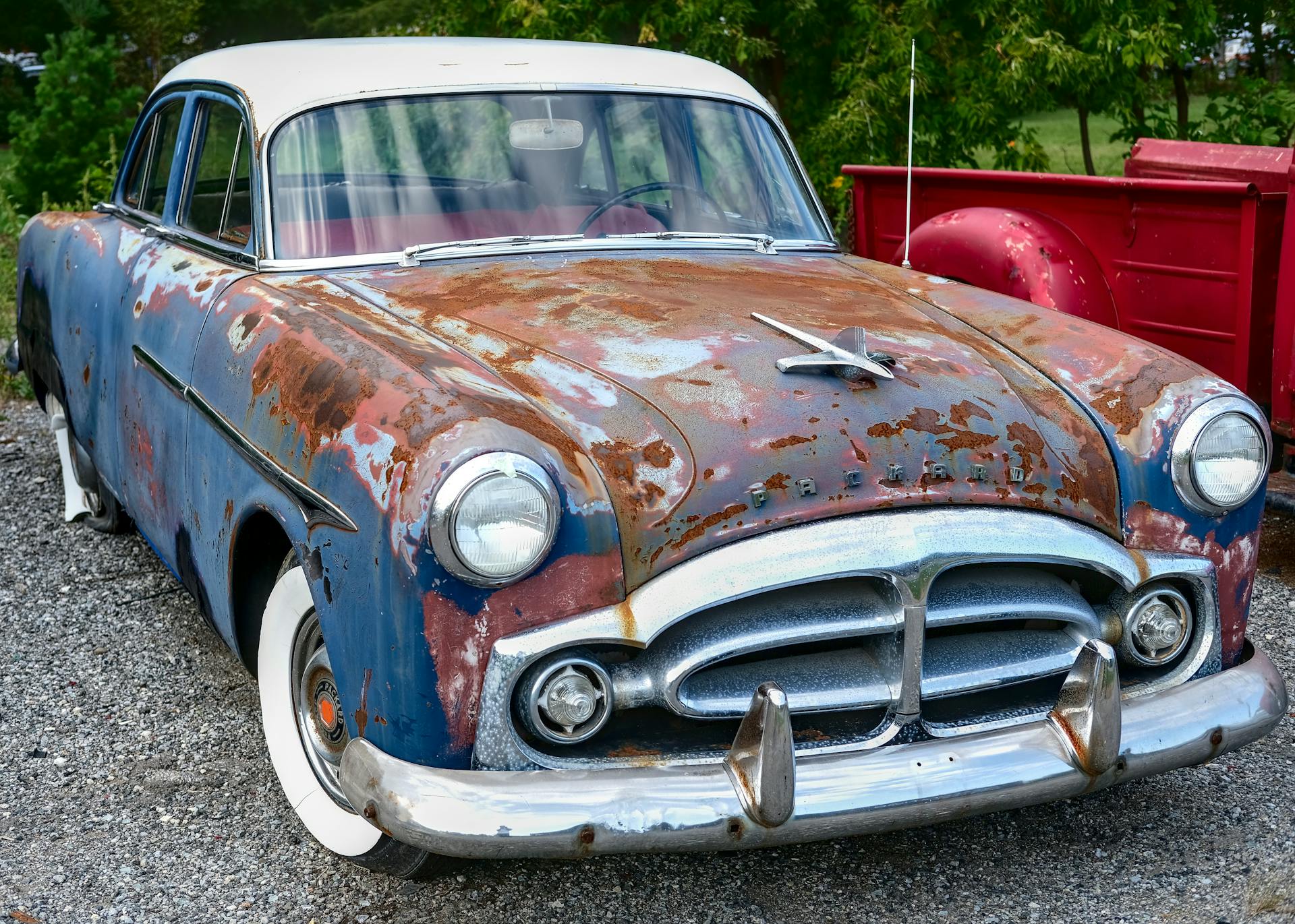 Rusting Packard in a Parking Lot