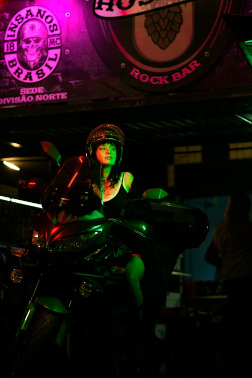 A Woman Sitting on the Motorcycle